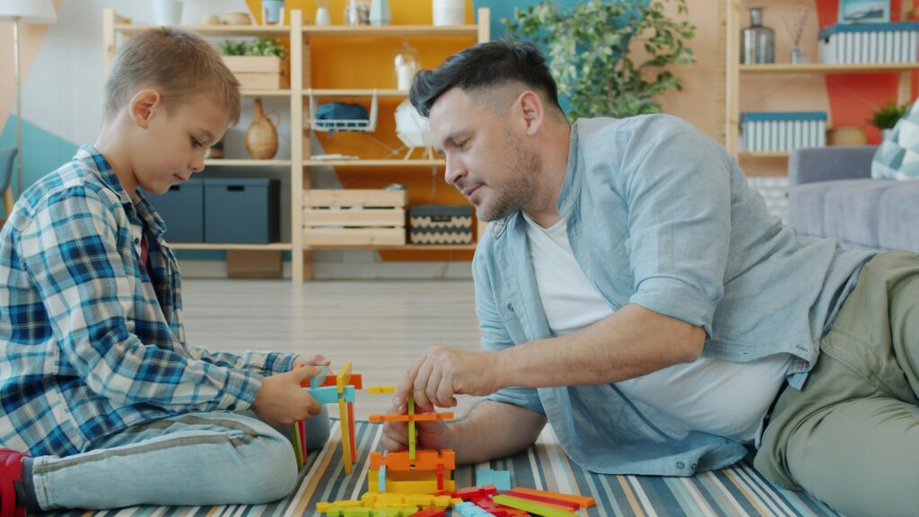 father son playing blocks