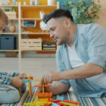 father son playing blocks
